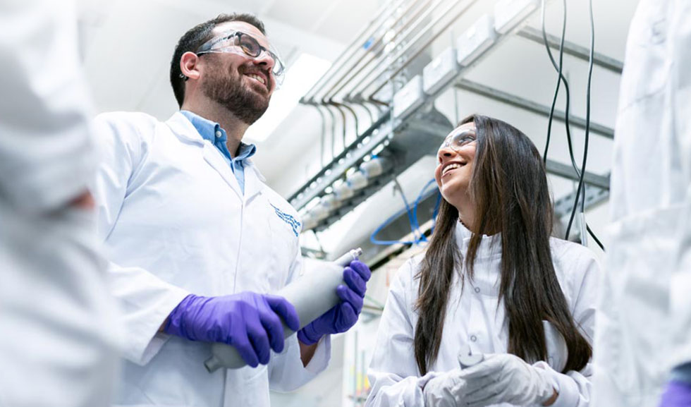 Core Services two joyful employees in amanufacturing facility